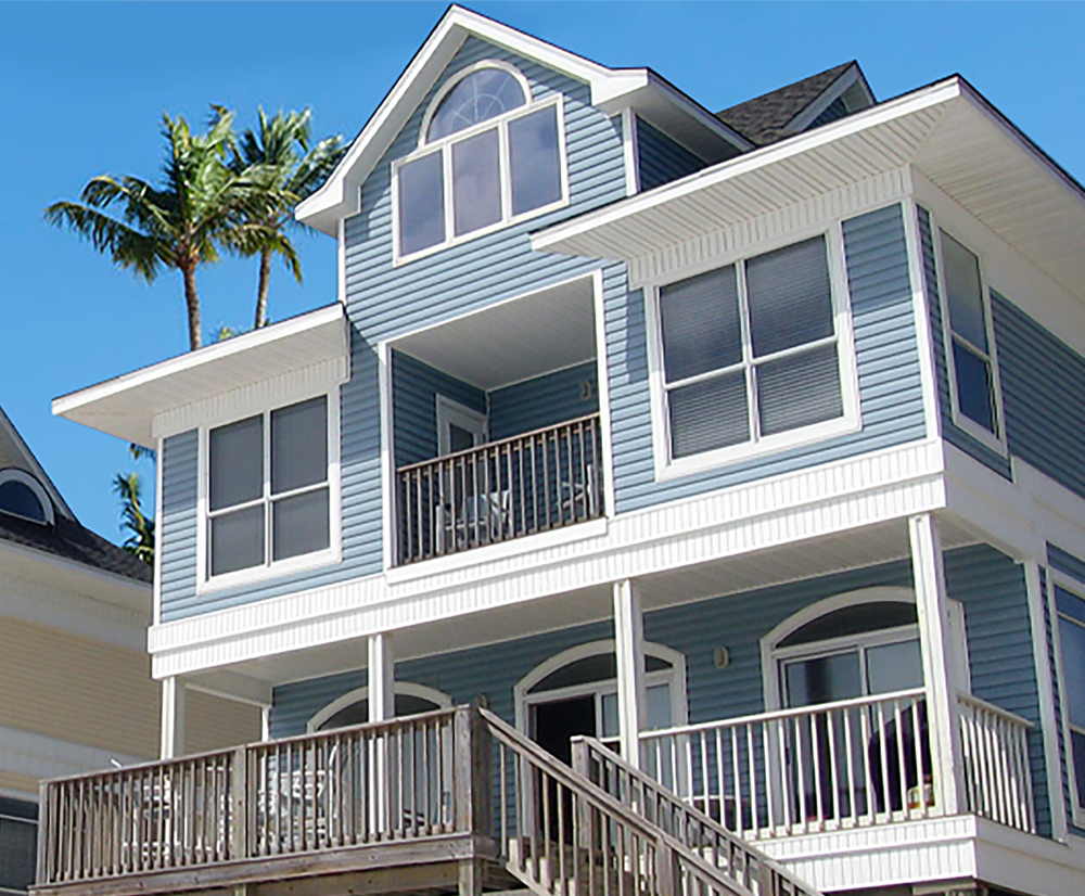blue beach house with new windows